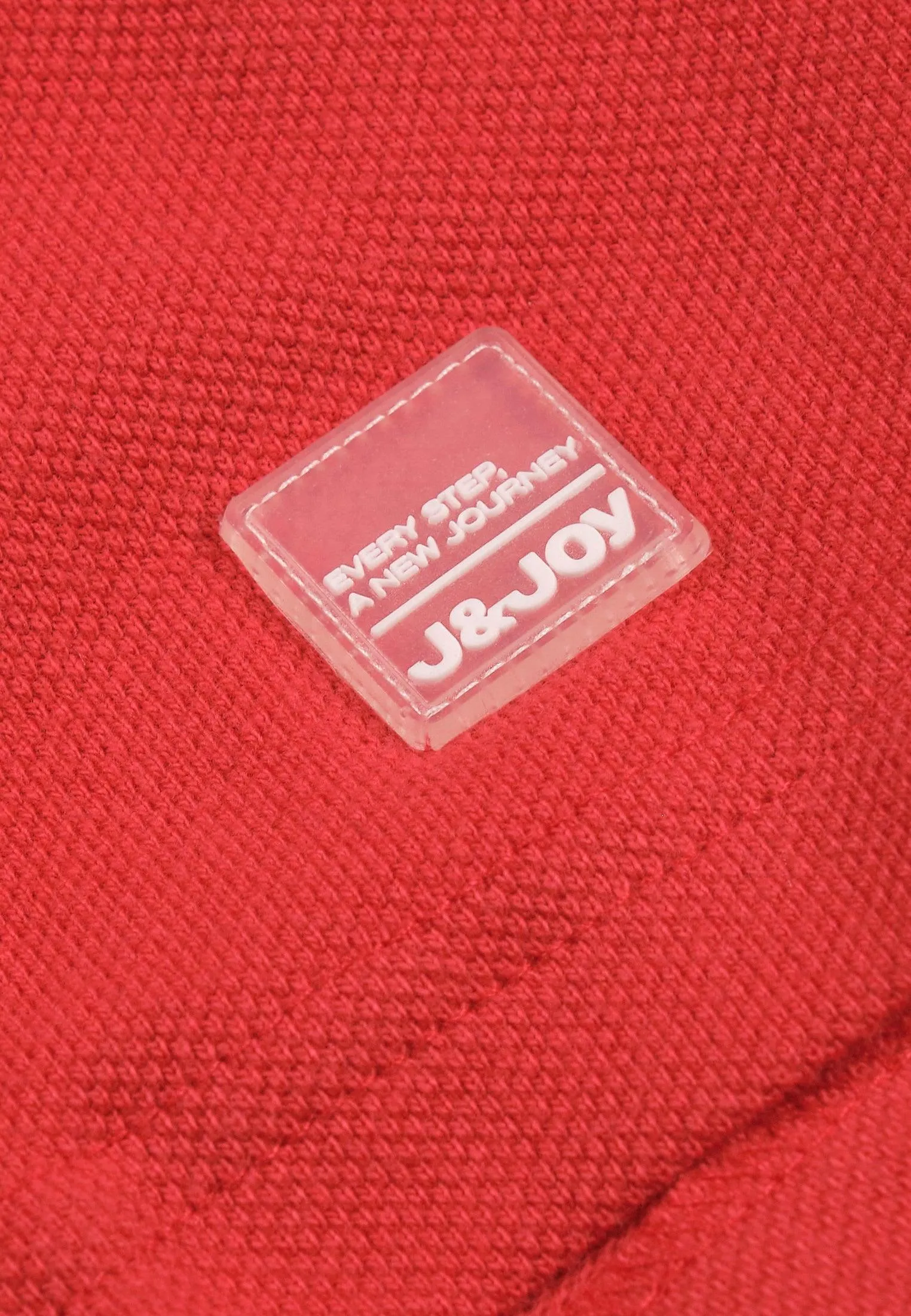 Polo garçon longues manches rouge avec bandes colorées sur les manches